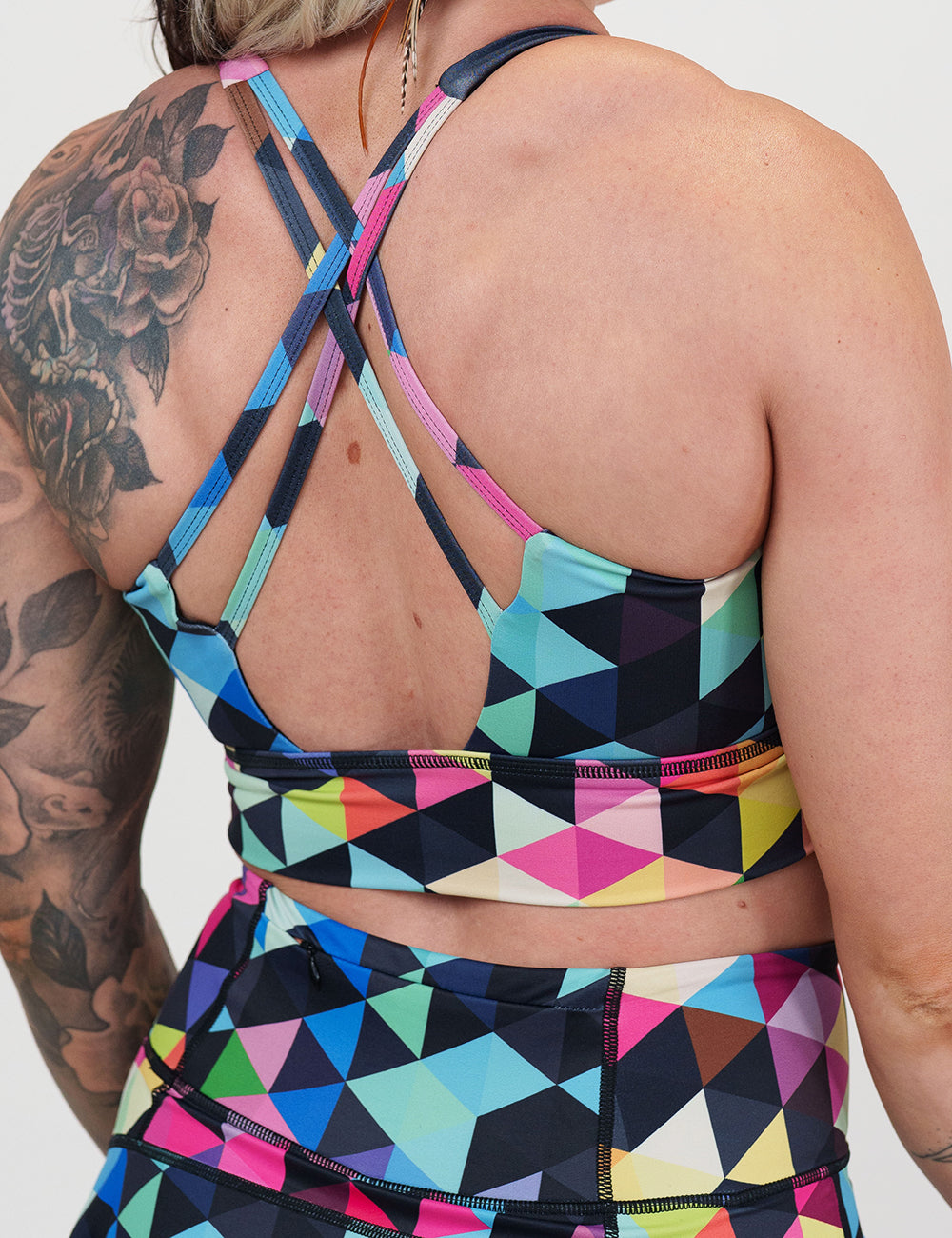 back of the rainbow color block patterned sports bra