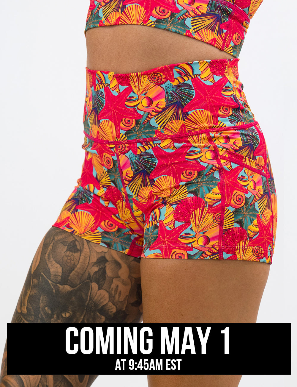 front of the red starfish with a yellow and blue shell background 2.5 inch shorts coming may 1st