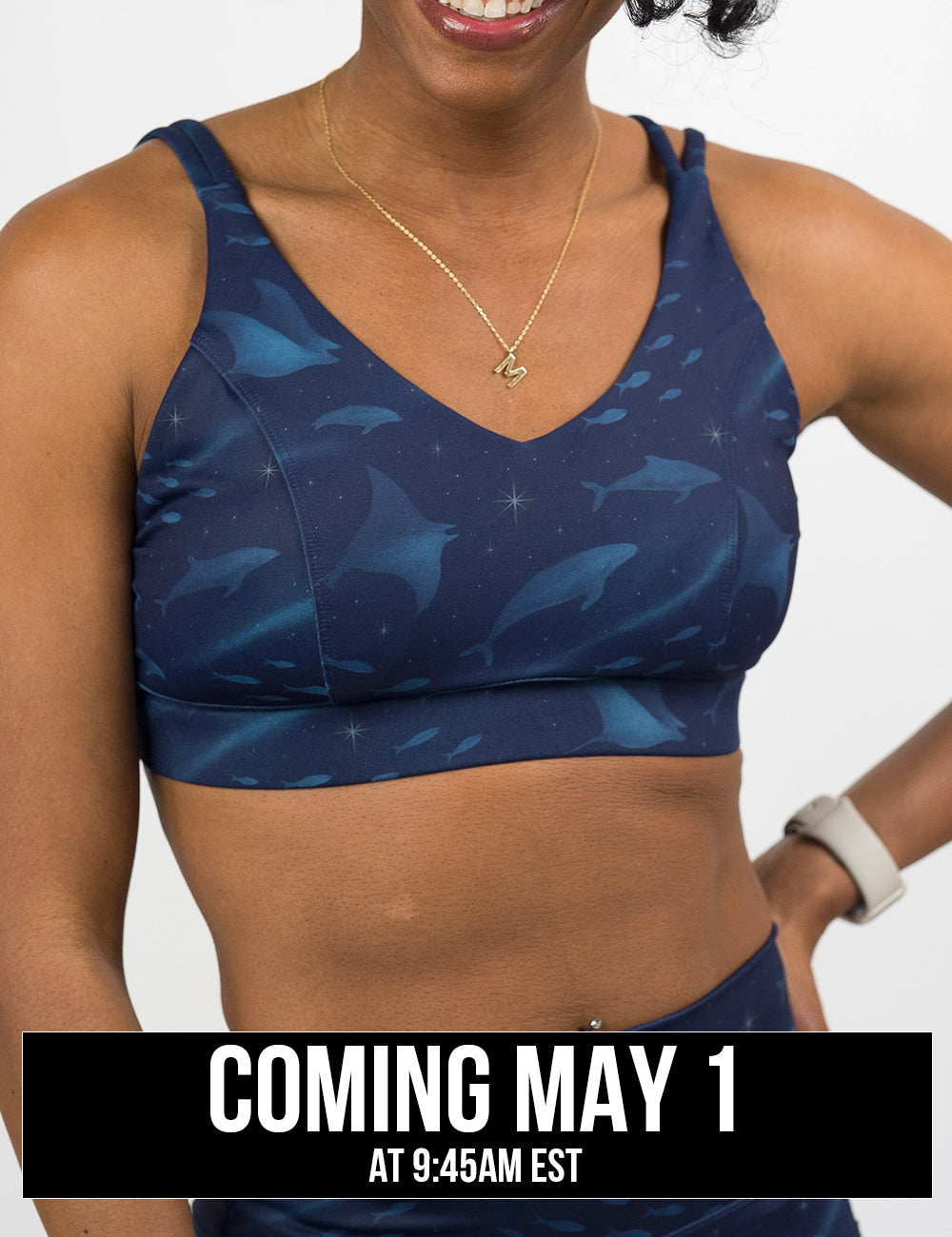 front of the dark blue ocean filled with sting rays, whales, and fish vitality bra, coming may 1st