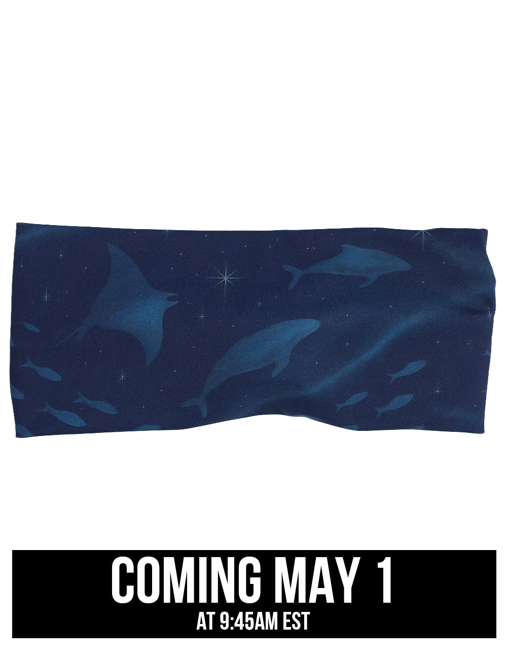 front of the dark blue ocean filled with sting rays, whales, and fish headband, coming may 1st