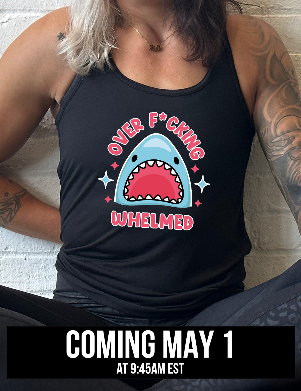 black racerback flowy tank with the graphic of a shark's head with mouth wide open, and the words around the graphic saying "over f*cking whelmed" and a few stars on the sides, coming soon