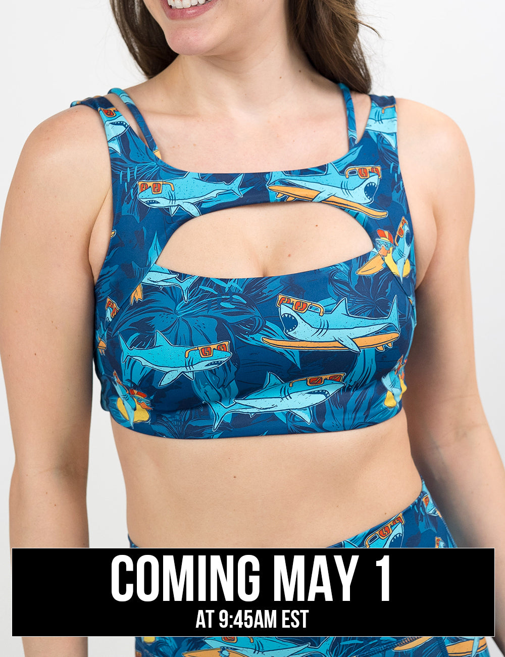front of the cartoon sharks surfboarding with sunglasses vista bra, coming may 1st