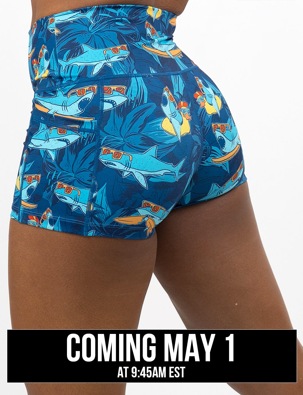 back of the 2.5 inch cartoon sharks surfboarding with sunglasses shorts, coming may 1st