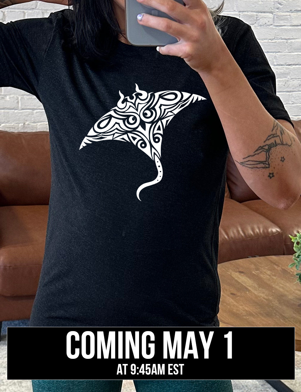 black unisex tee with the graphic of a manta ray in tribal design, coming soon