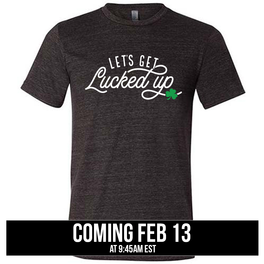 black unisex tee with the words "let's get lucked up" on it with the graphic of a small shamrock, coming soon