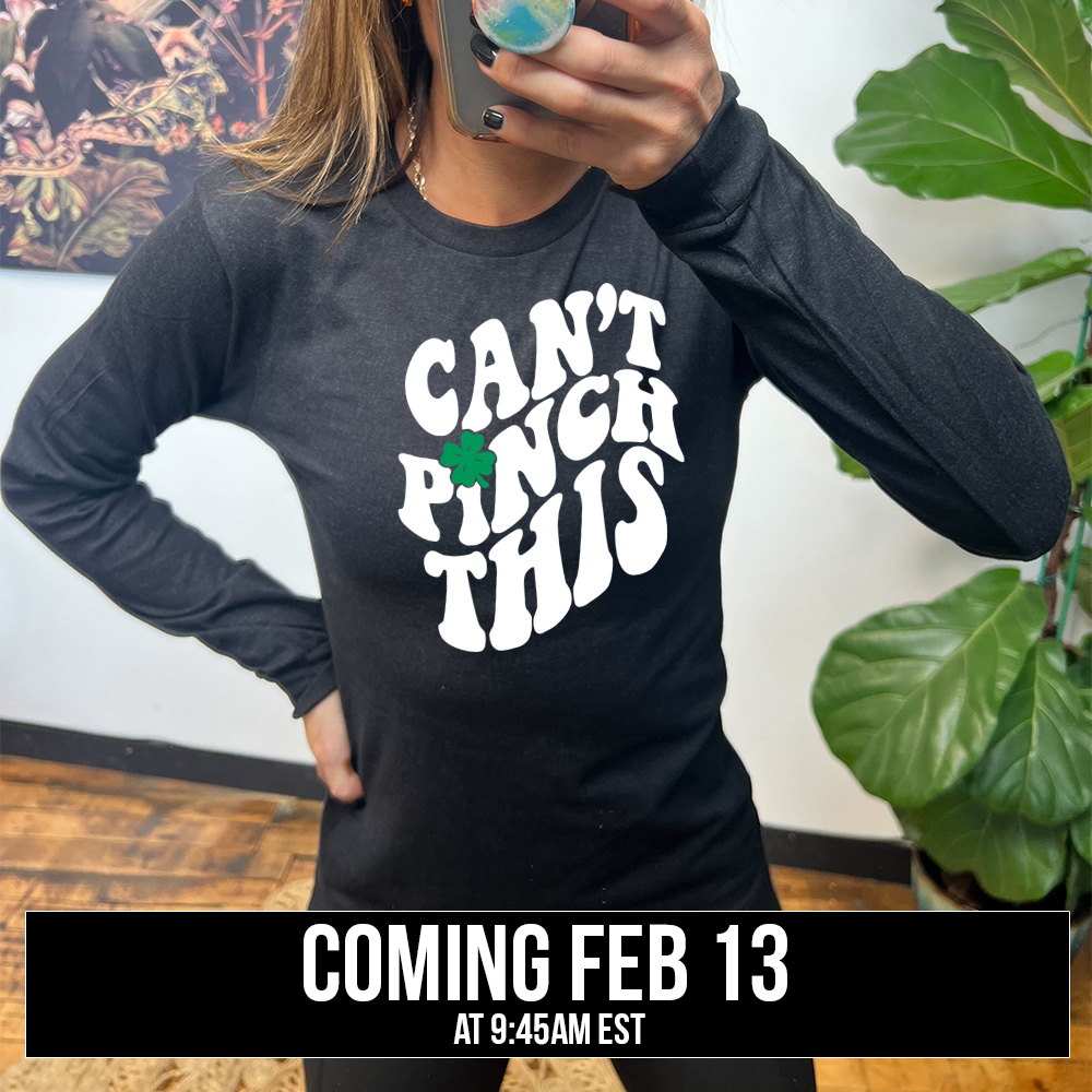 heather black long sleeve with the words "can't pinch this" with a clover above the "i" of "pinch", coming soon