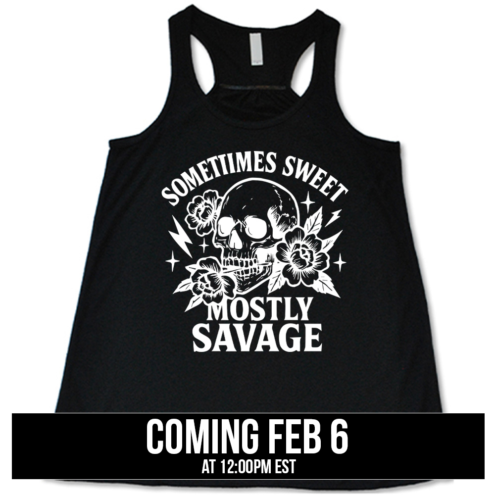 black flowy tank with the words "sometimes sweet mostly savage on it with the graphic of a skull holding a flower between its teeth, with a couple flowers and a few stars and lightening bolts around it, coming soon