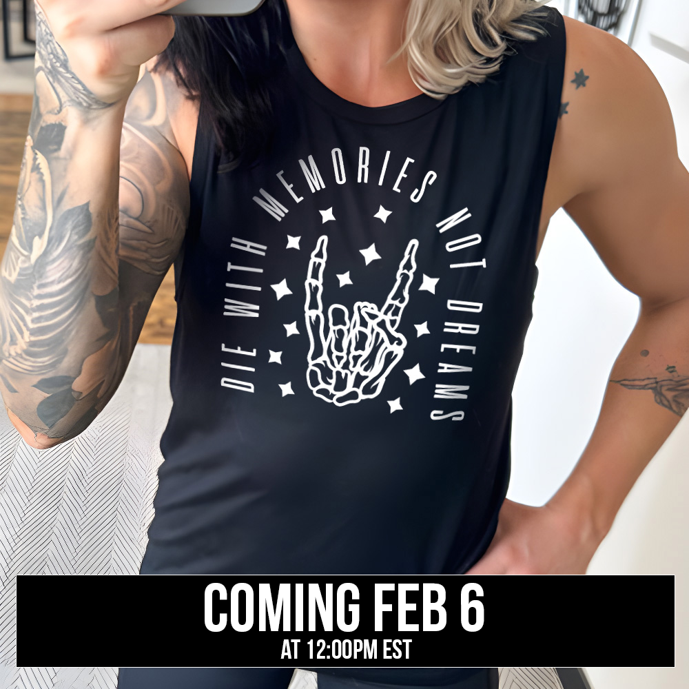 black muscle tank with the graphic of a rocker skeleton hand, surrounded by little stars as well as an archway of text saying "die with memories not dreams" , coming soon