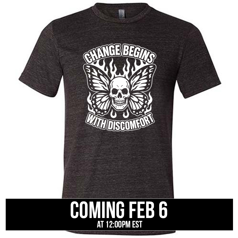 black unisex tee with the words "change begins with discomfort" surrounding the graphic of a skull with flaming butterfly wings, coming soon