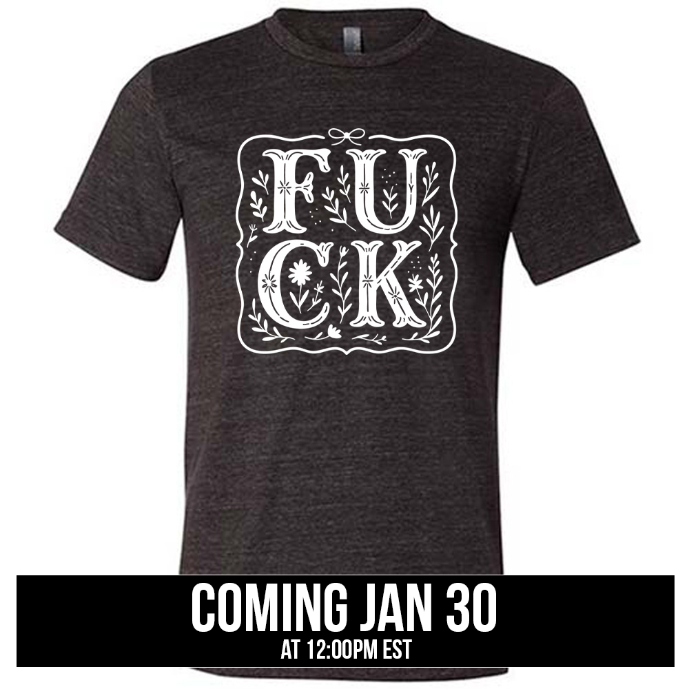 black unisex tee that has the word "FUCK" in large, flowery font, spaced out so that the F and U are directly above the C and K, and the word is surrounded by a a few branches and a boarder, coming soon