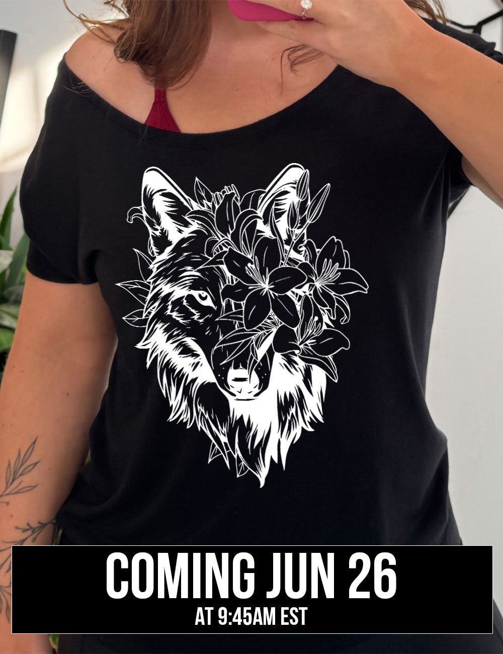 black slouchy tee with the large graphic of a wolf's head, with lilies covering half of the face, and growing behind its head too, coming june 26th