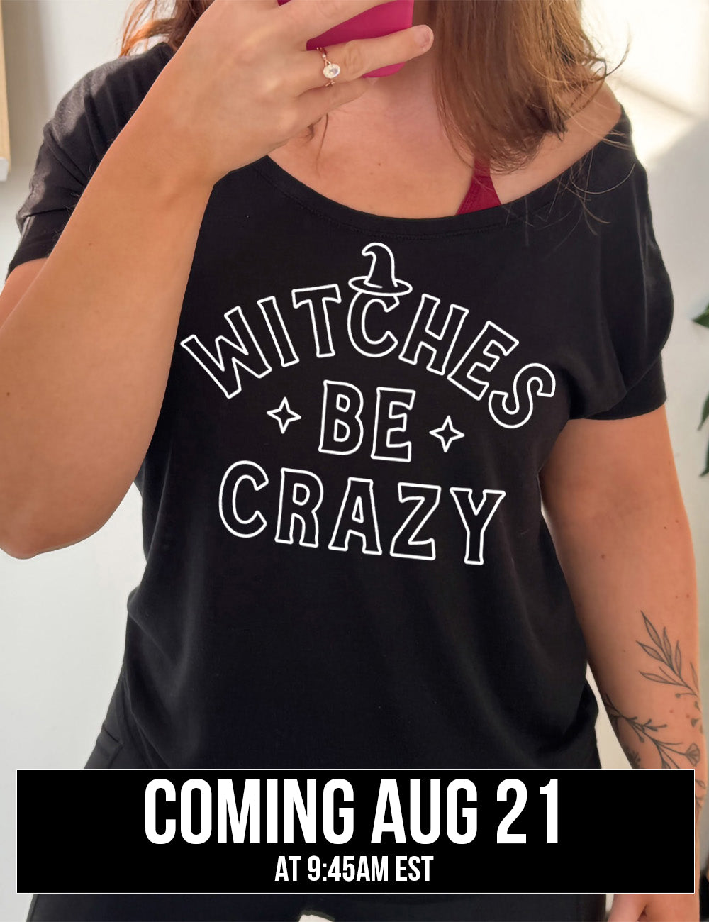 black modern tee with the words in outline font saying "witches be crazy" with a witch hat on top of the "c" in "witches" and a star on either side of the word "be", coming august 21st