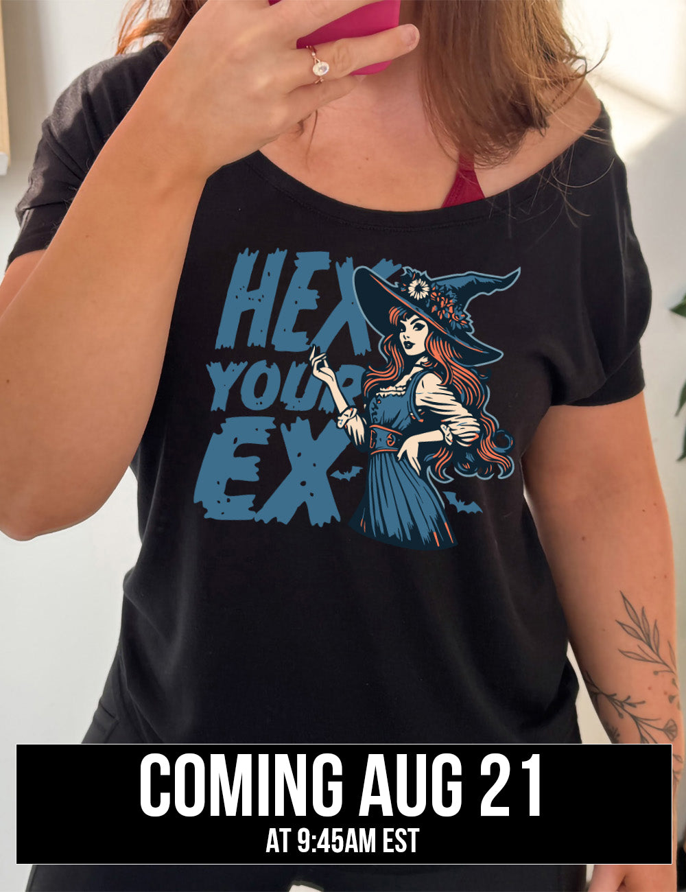 black slouchy tee with the words "hex your ex" on it, next to the detailed, colorful graphic of a long-haired witch, hand on hip, other hand raised, wearing a flowery witch hat, and an old-fashioned dress, coming august 21st