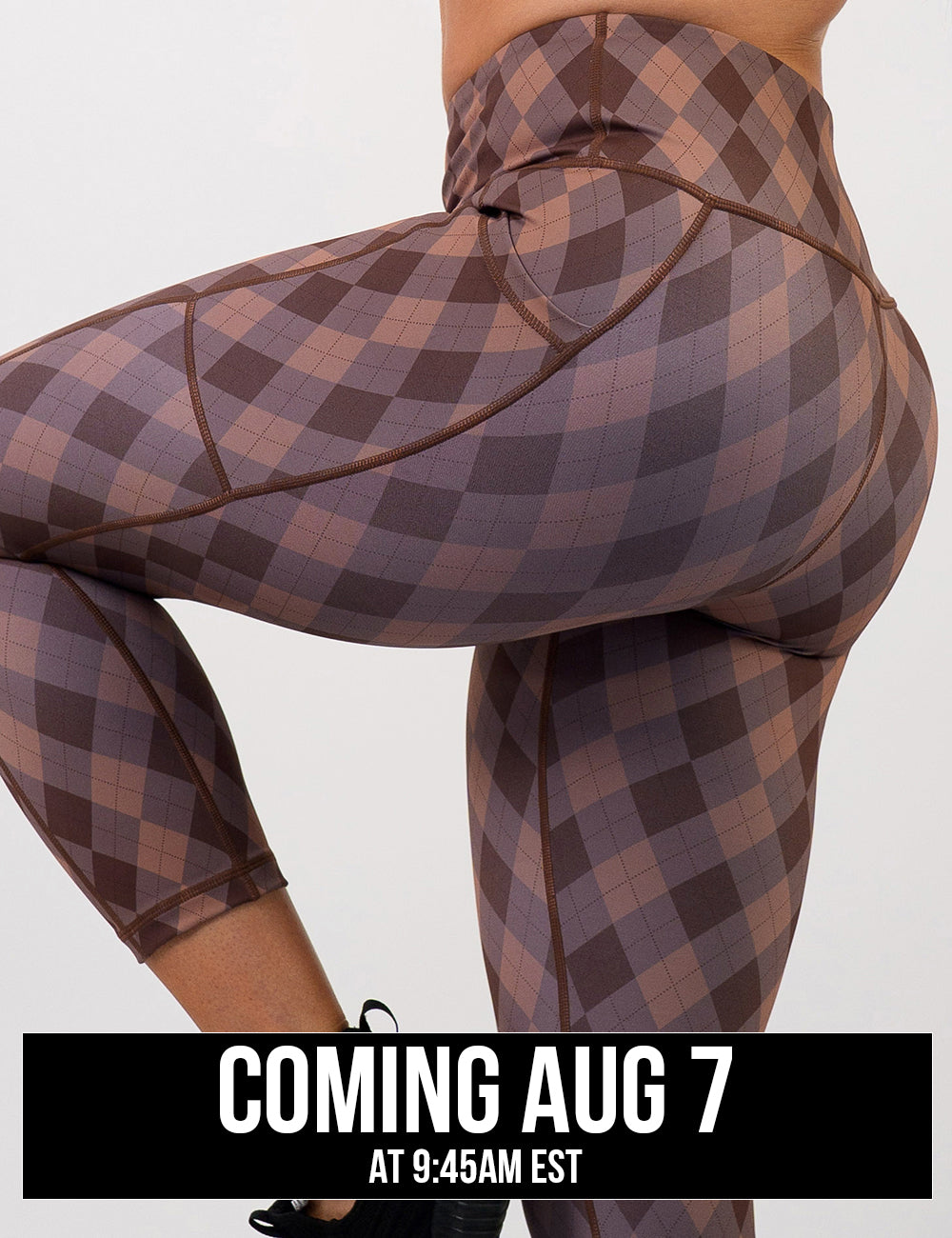 front of the grey, beige, and dark red plaid leggings, coming august 7th