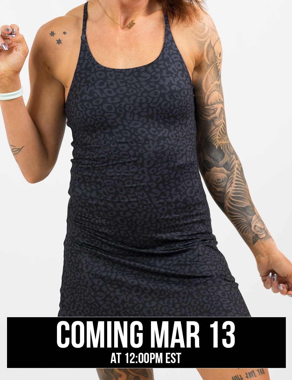 model wearing black leopard print dress coming soon