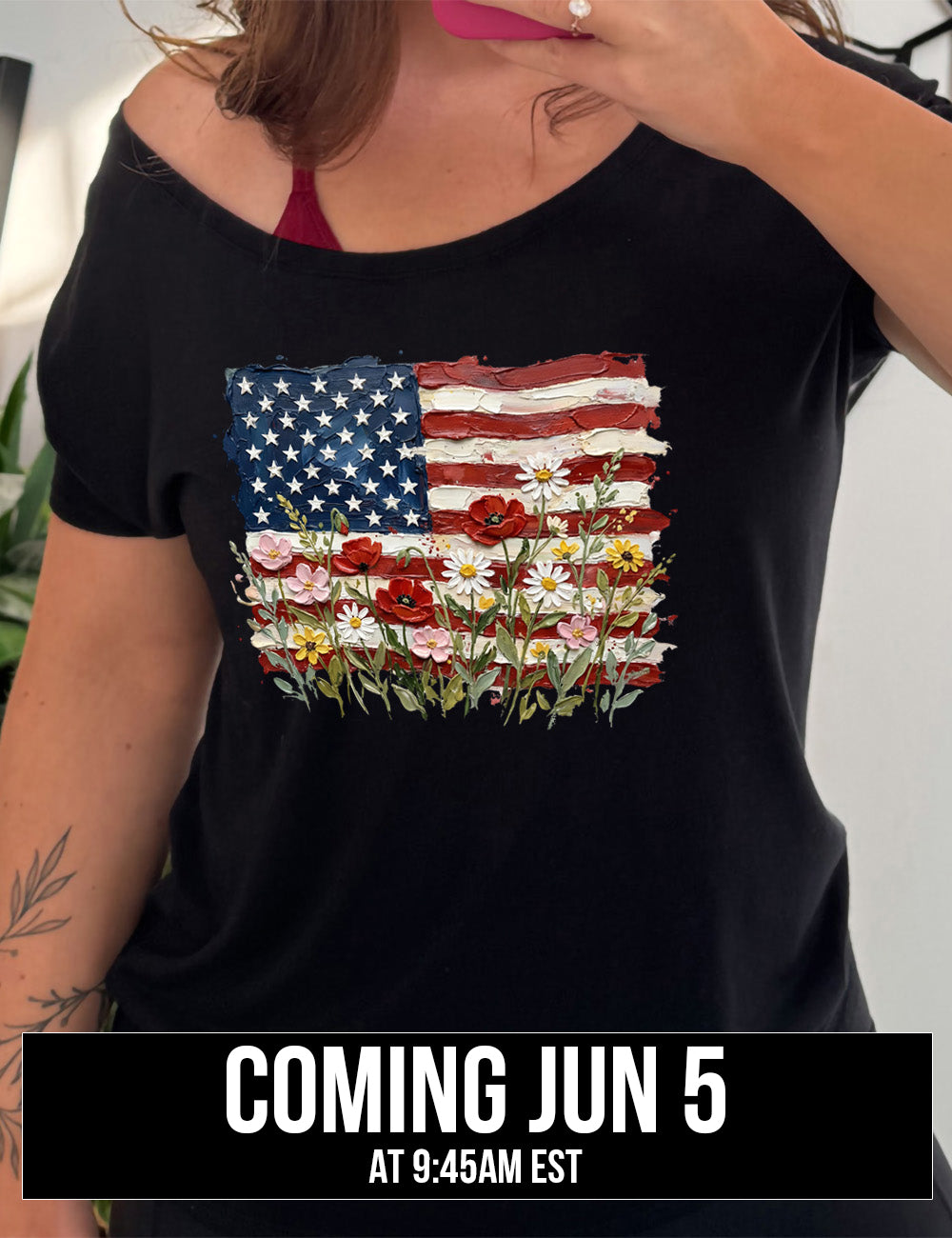 black slouchy tee with the graphic of an American flag with flowers in front of it, with the style of the graphic looking made of oil paint, coming june 5th