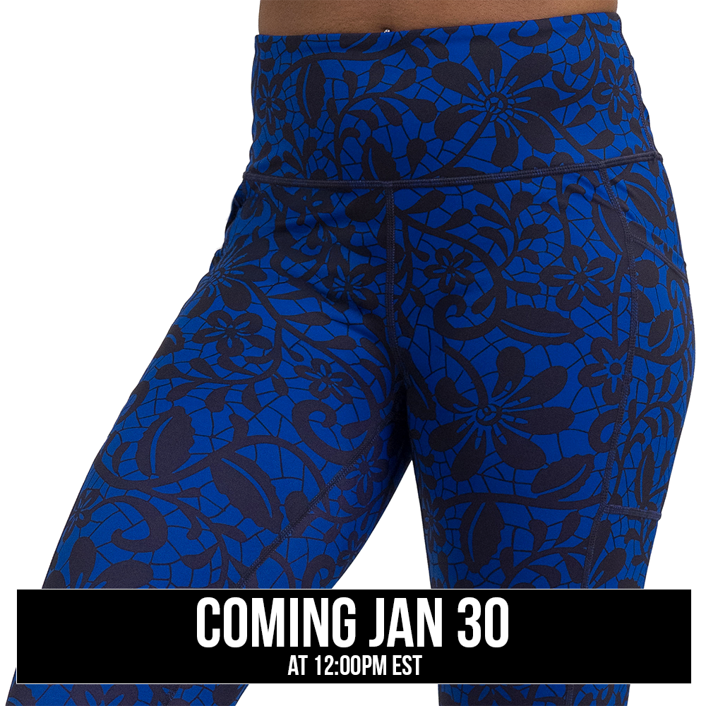 close up of black floral against a dark blue background pattern leggings against a white background, coming soon