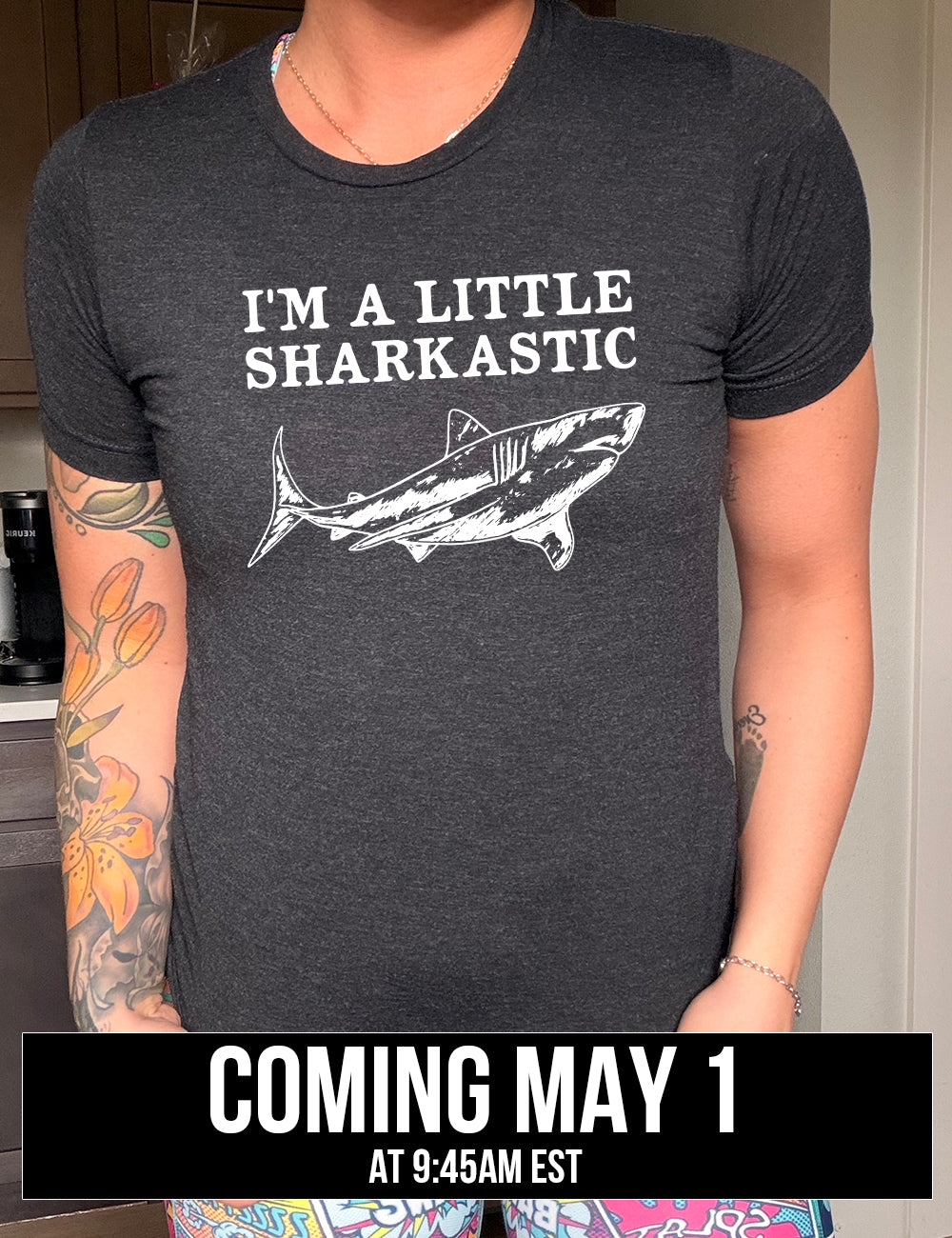 black unisex tee with the words "I'm a little sharkastic" on it, over the graphic of a shark, coming soon