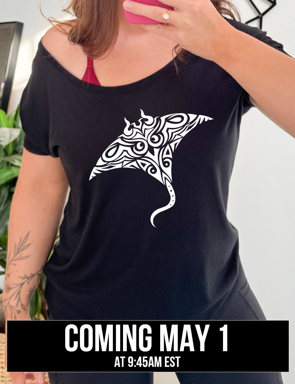 black slouchy tee with the graphic of a manta ray in tribal design, coming soon