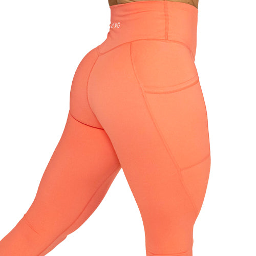 close up of solid coral leggings