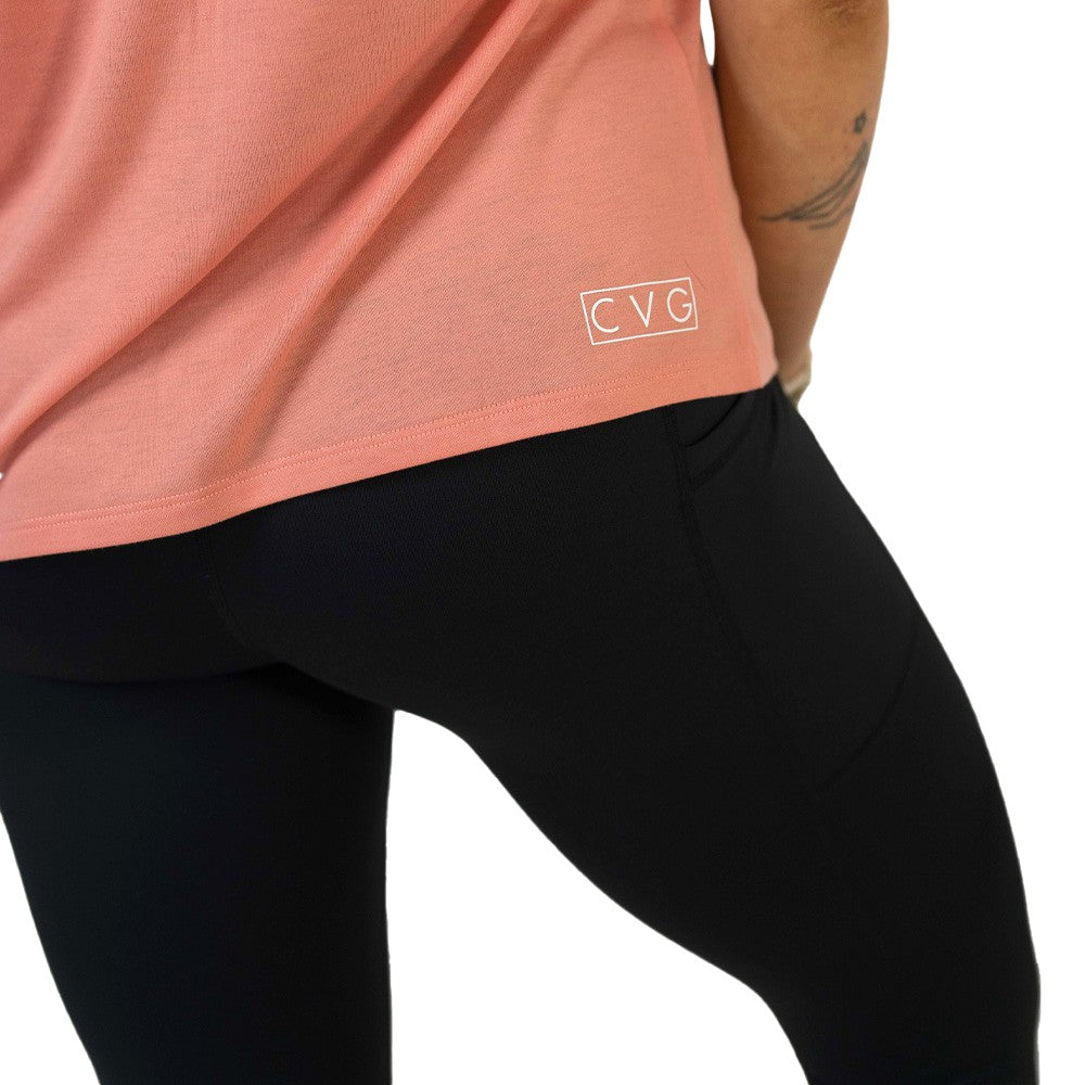 coral shirt with 'CVG' logo on a white background