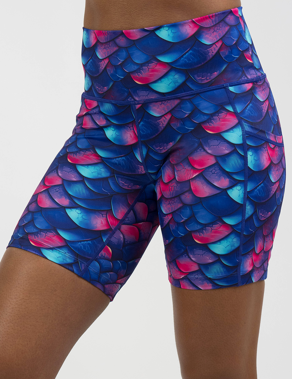 blue, purple, and red colored dragon scale 7 inch shorts facing the front against a white background