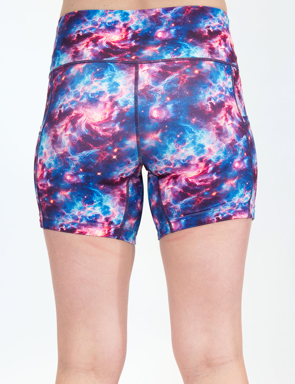 back of the 7 inch galaxy patterned shorts against a white background