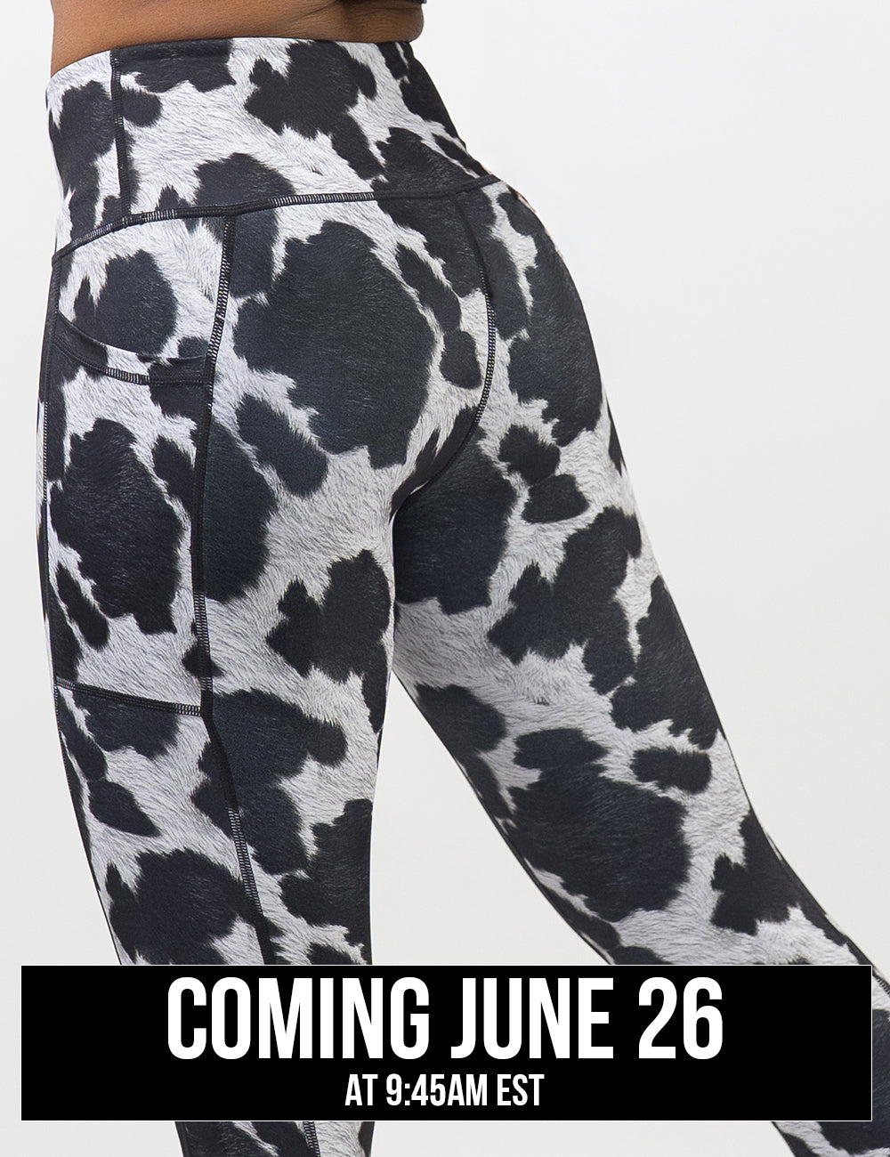 back of the cow print leggings against a white background, coming june 26th