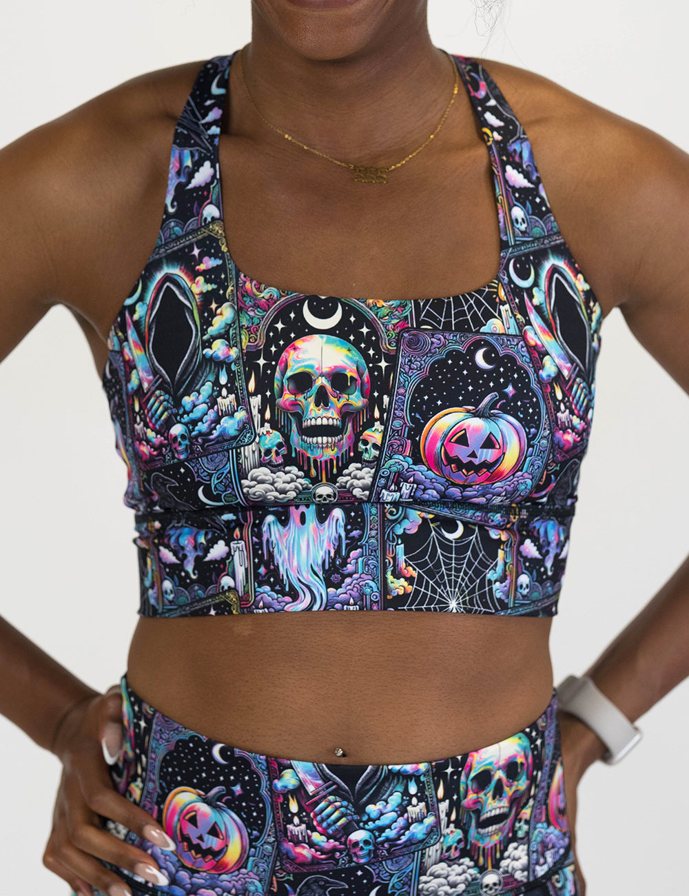 front of the rainbow skulls, jack o lantern, and ghosts bra against a white background