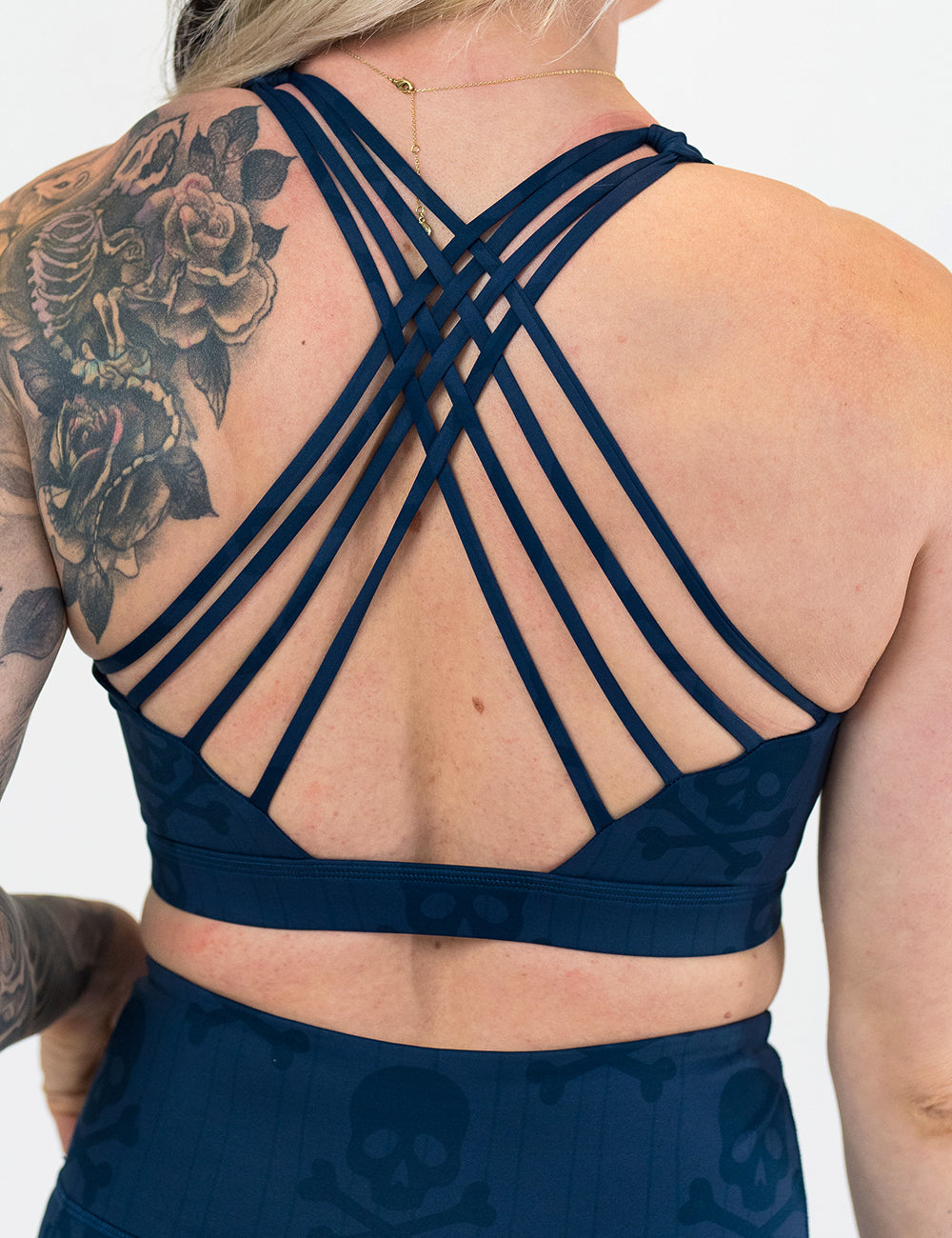 back of the skull and bones patterned sports bra