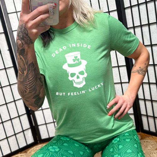 green unisex shirt with a white leprechaun skull graphic on it