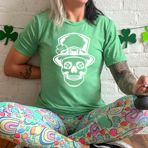 green unisex shirt with a leprechaun skull graphic on it in white