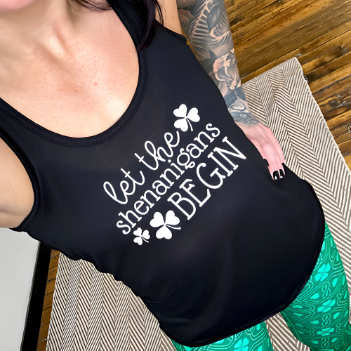 black racerback tank top with the saying "let the shenanigans begin" in white