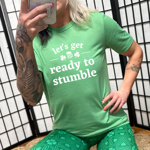 green unisex shirt with the saying "let's get ready to stumble" on it in white