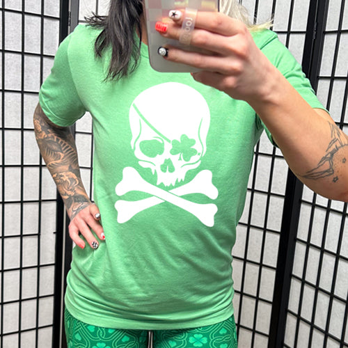 green unisex shirt with a shamrock skull graphic on it in white