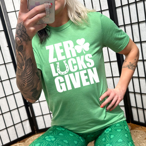 green unisex shirt with the saying "zero lucks given" on it in white