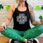 model wearing the black racerback tank top with a celtic knot graphic in white