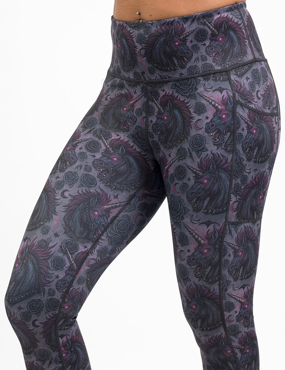 front of the dark unicorn leggings against a white background
