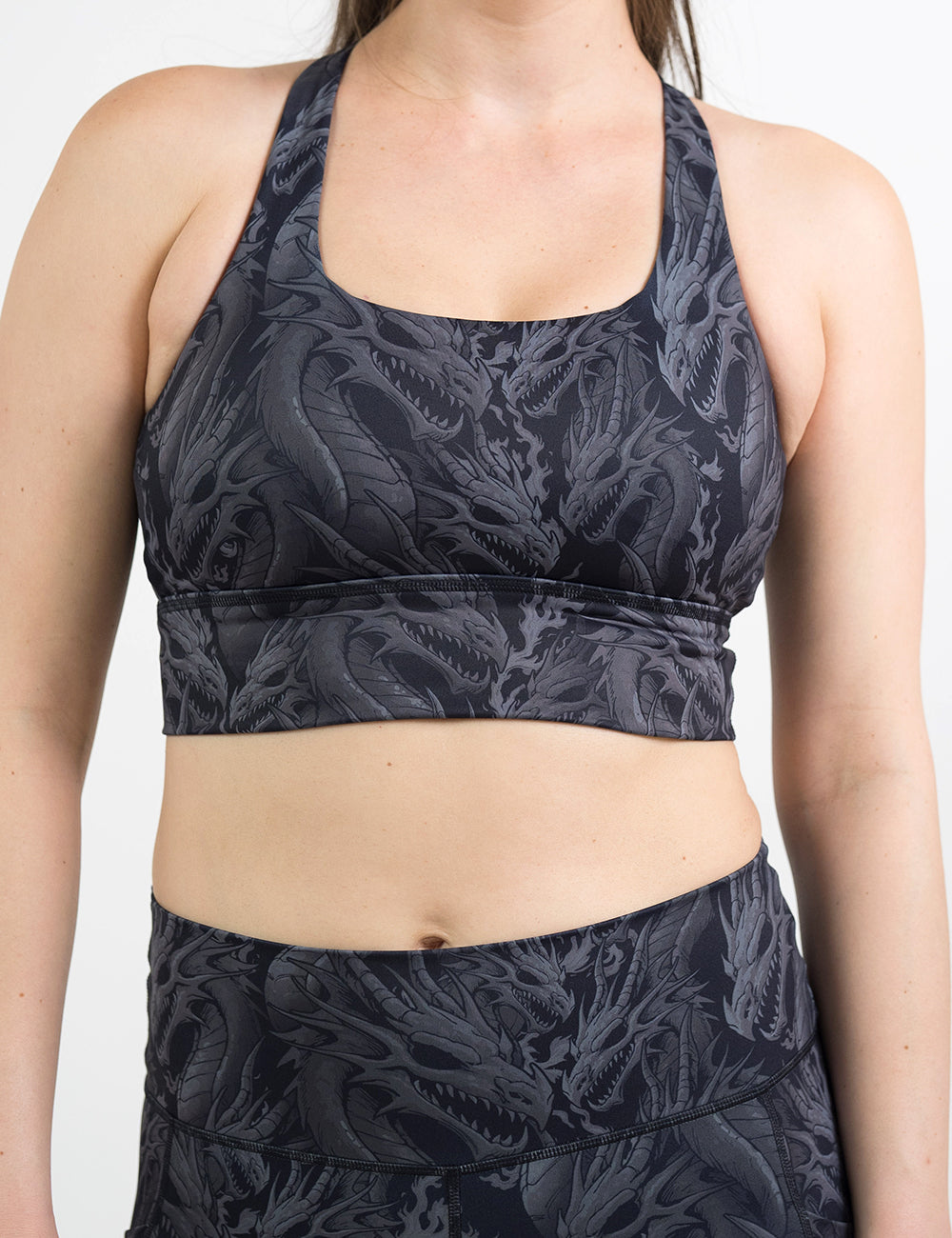 front of the black longline bra with a grey dragon pattern against a white background