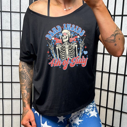 black slouchy tee with the saying "dead inside but it's 4th of july" with a skeleton on it
