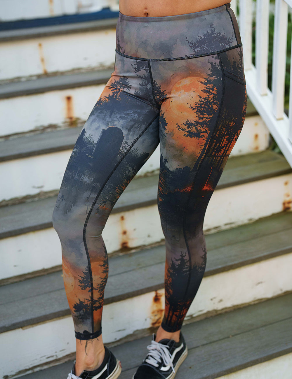 model wearing the dark cemetery with a full moon full length leggings
