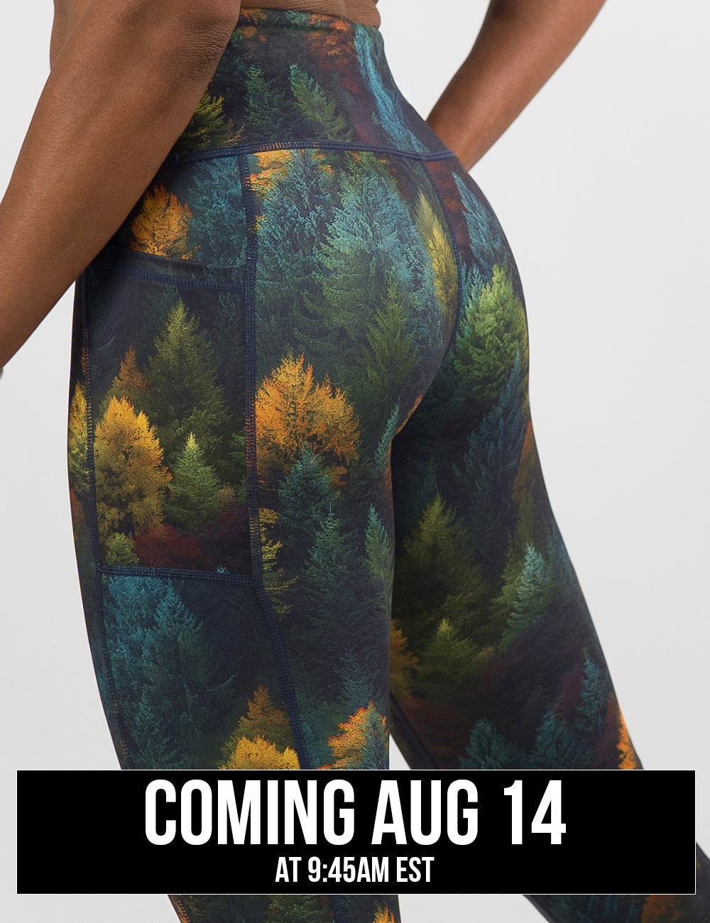 back of the orange, green, and bluish green trees leggings against a white background, coming august 14th
