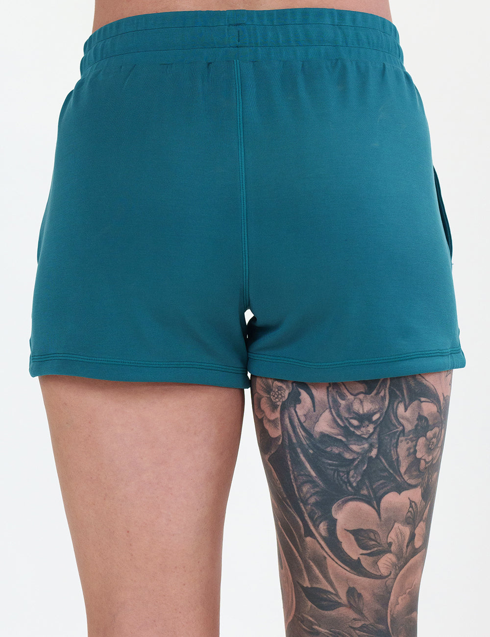 back of the teal shorts against a white background