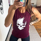 Model wearing a maroon muscle tank with a skull design on the front in white