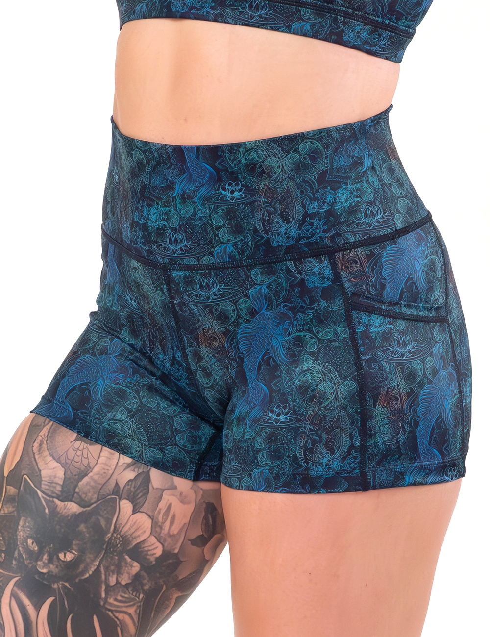 front of the 2.5 inch stenciled koi pattern against a blue background shorts