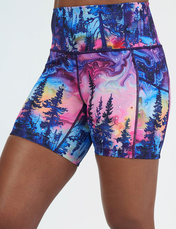 close up of the watercolor rainbow patterned forest 5 inch shorts facing the front against a white background