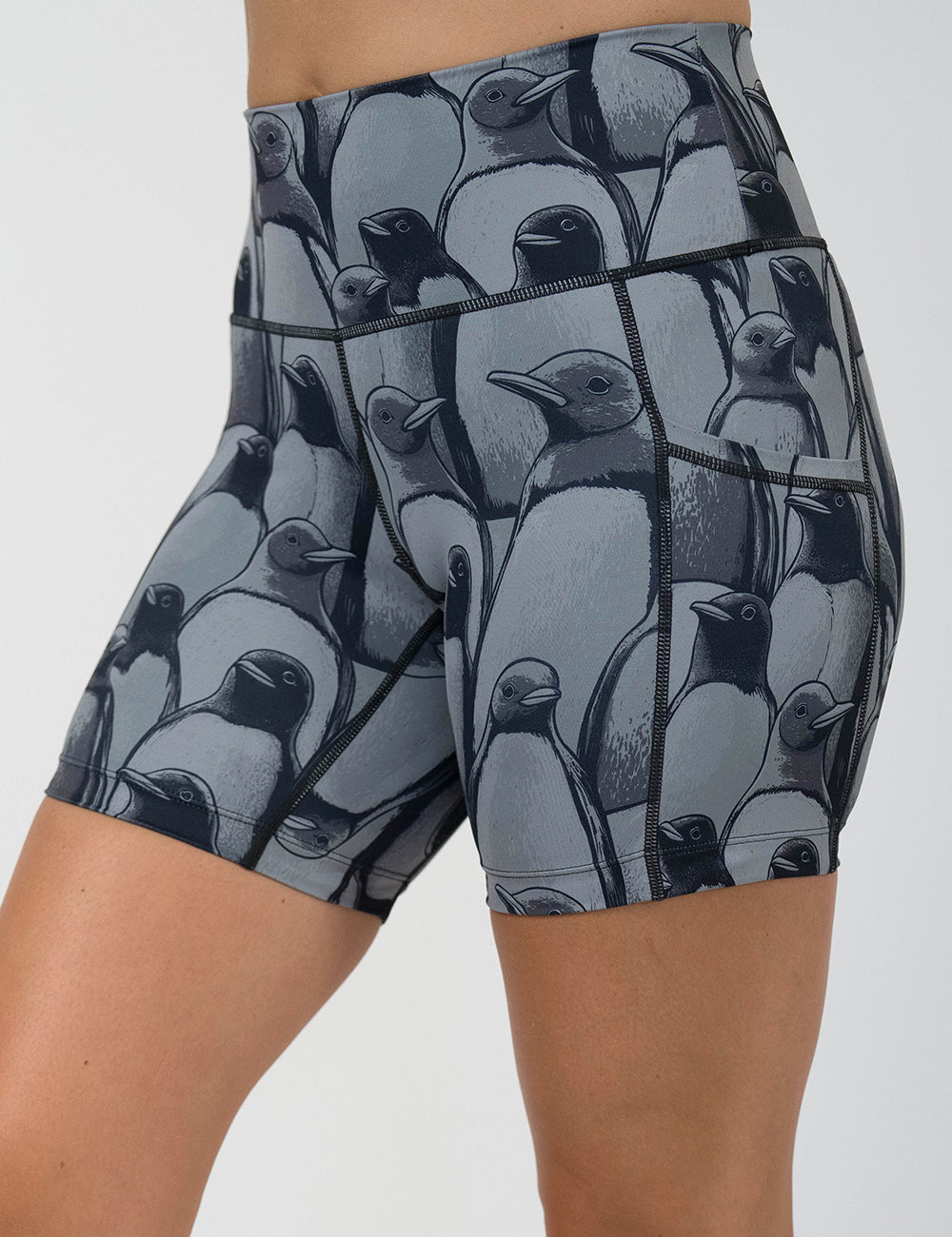 front of the 5 inch penguin patterned shorts against a white background