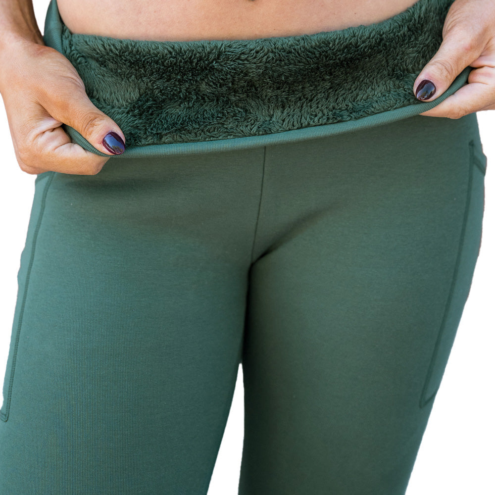 photo showing close up of green fleece lined inside material of green solid colored leggings