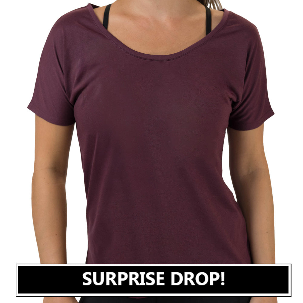 maroon off-shoulder top worn by a person on a white background with 'SURPRISE DROP!' text at the bottom.