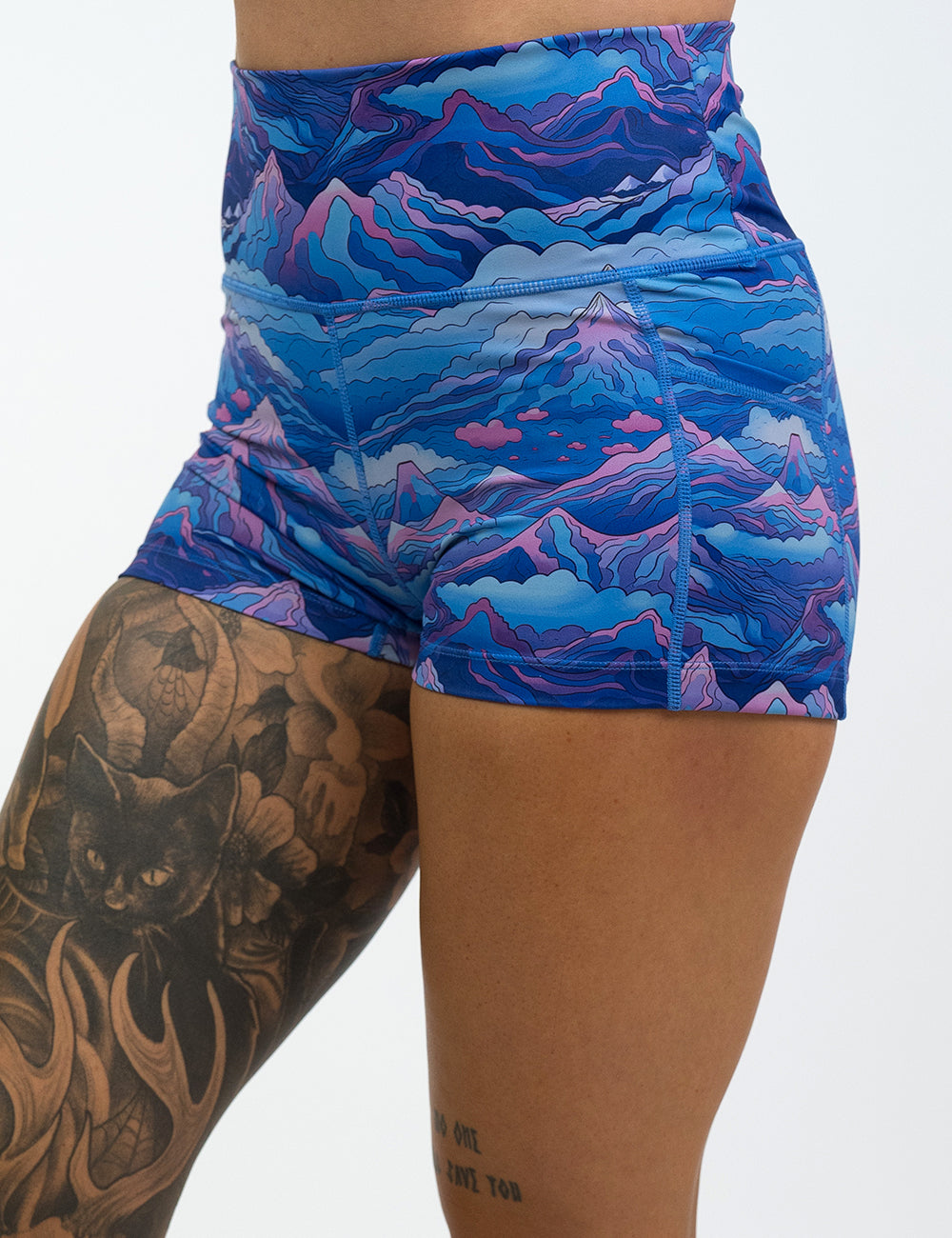front of the 2.5 inch blue and pink mountains shorts against a white background